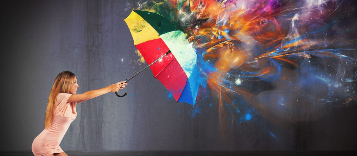 Sexy woman protect against a colors explosion